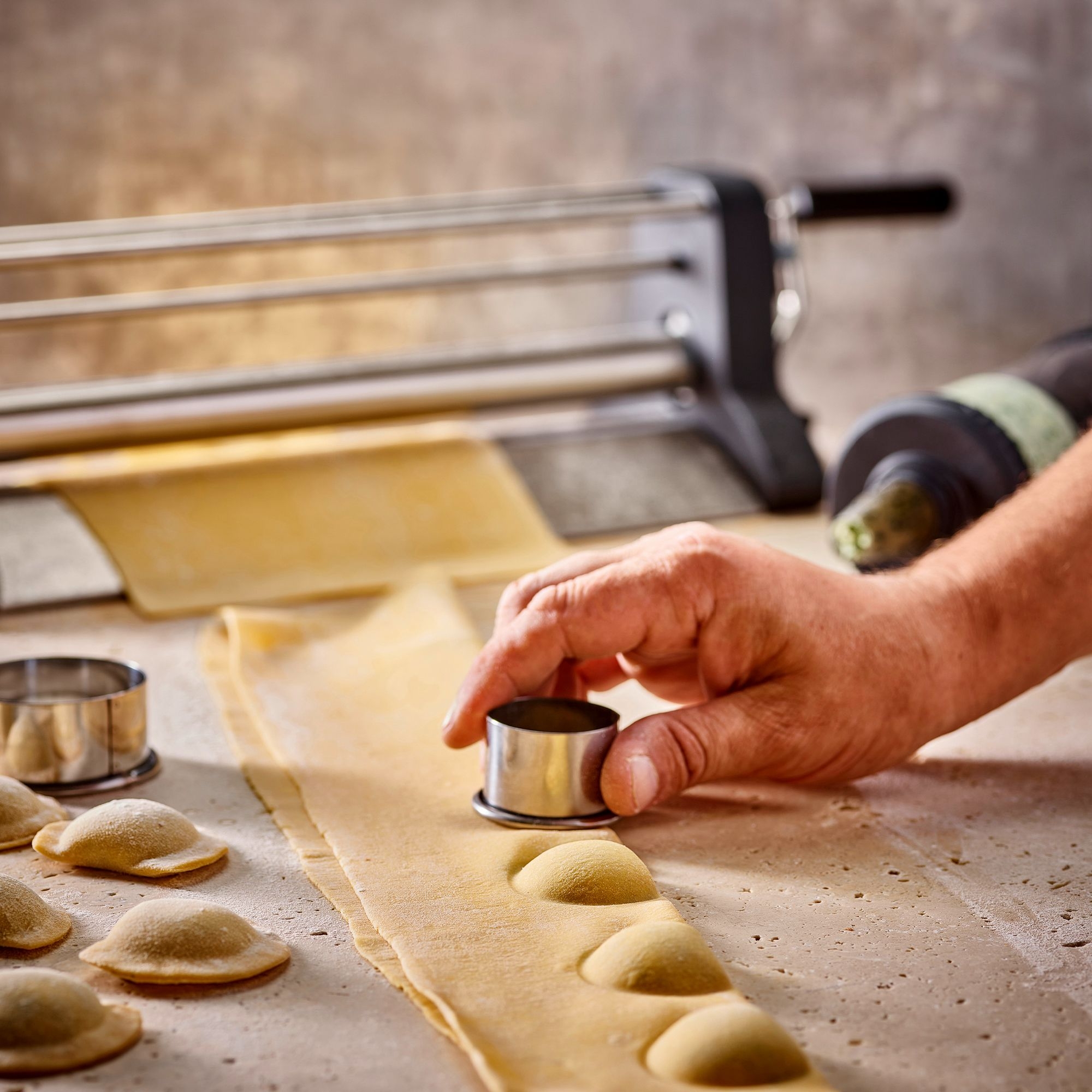Hand shaping ravioli from fresh pasta dough